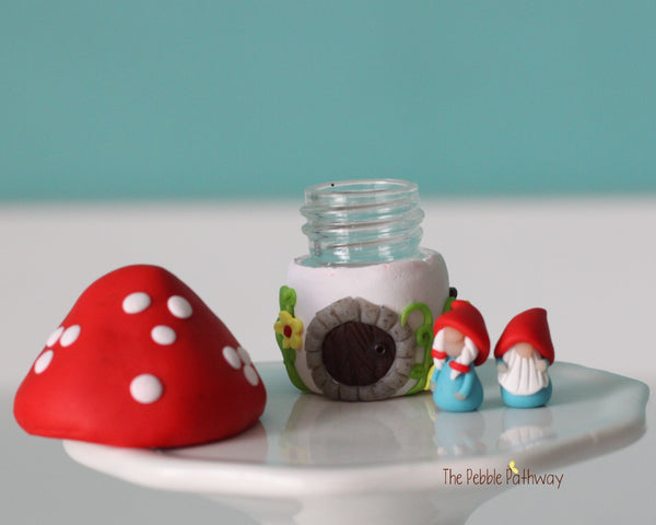 Tiny red mushroom with yellow flowers gnome home with removable top and gnomes inside