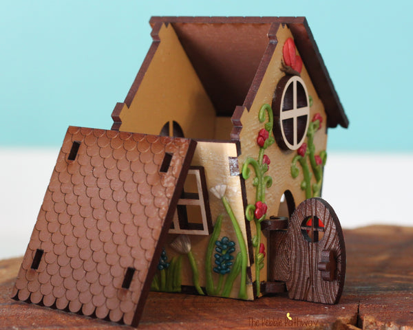 Tiny gnome home with itty bitty girl gnome - springtime miniature house with wildflowers