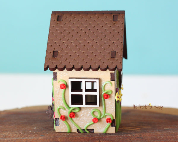 Tiny gnome home with itty bitty girl gnome - springtime miniature house with wildflowers