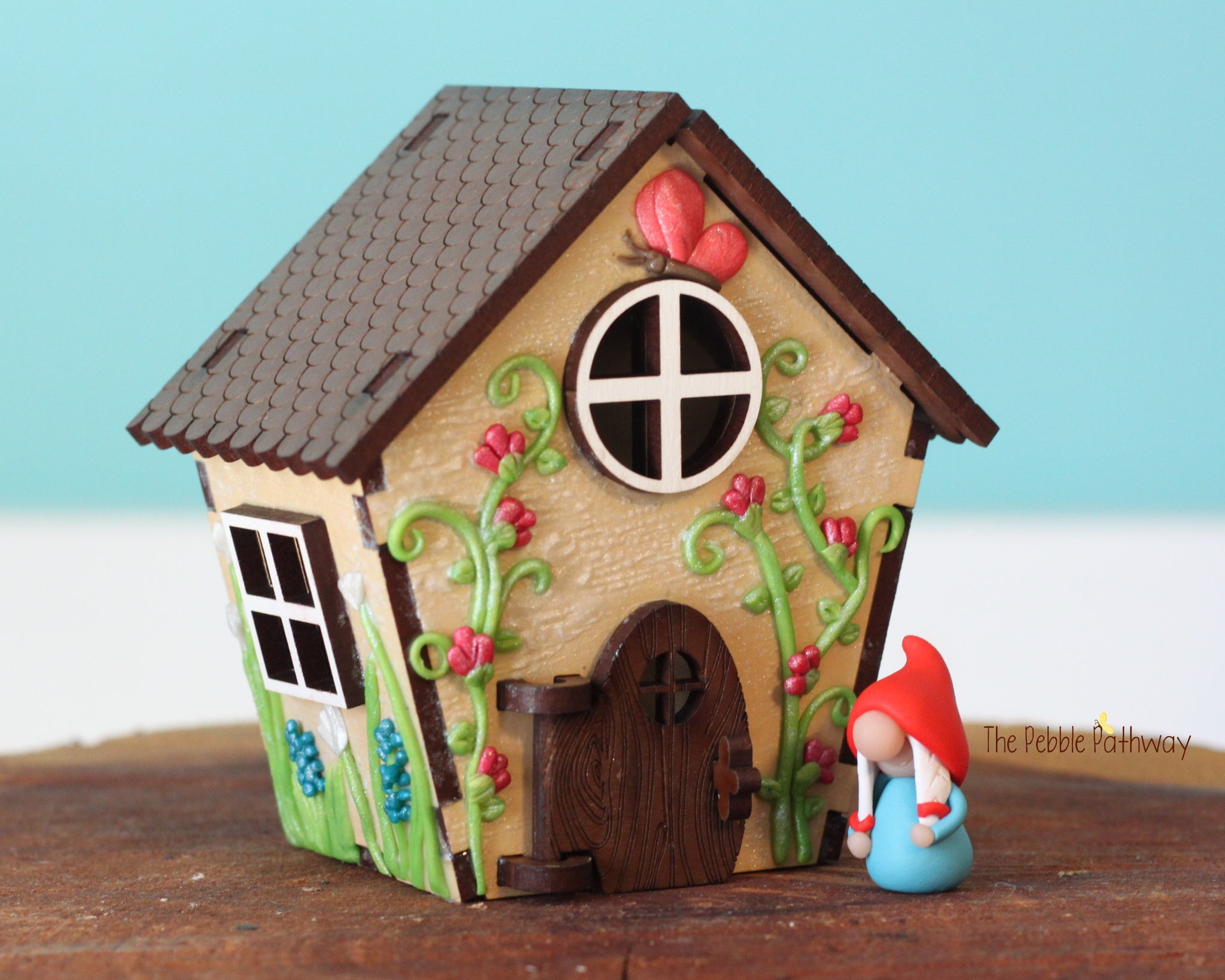 Tiny gnome home with itty bitty girl gnome - springtime miniature house with wildflowers