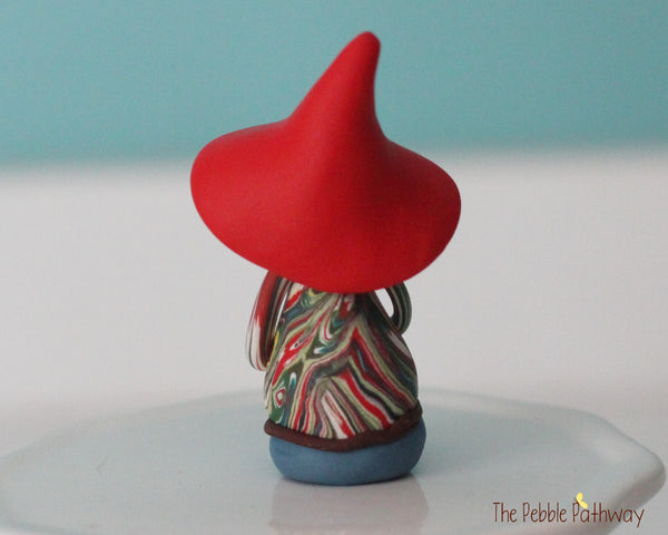 Hippie Gnome with tie dye shirt and blue peace sign