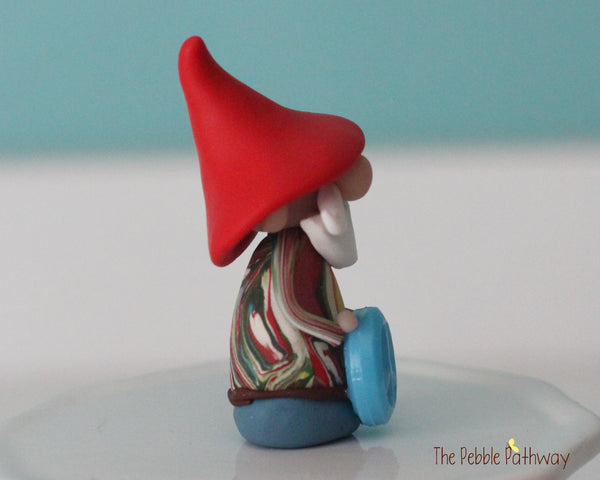 Hippie Gnome with tie dye shirt and blue peace sign