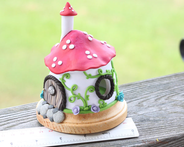 Mushroom Fairy House with vines and colorful flowers