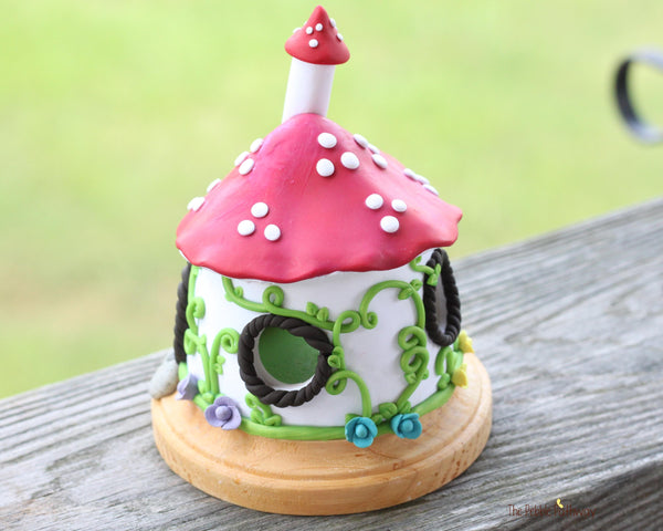 Mushroom Fairy House with vines and colorful flowers