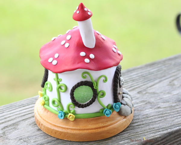 Mushroom Fairy House with vines and colorful flowers