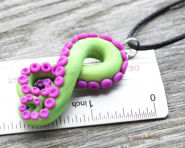 Green tentacle pendant and earrings with purple suckers, octopus themed jewelry