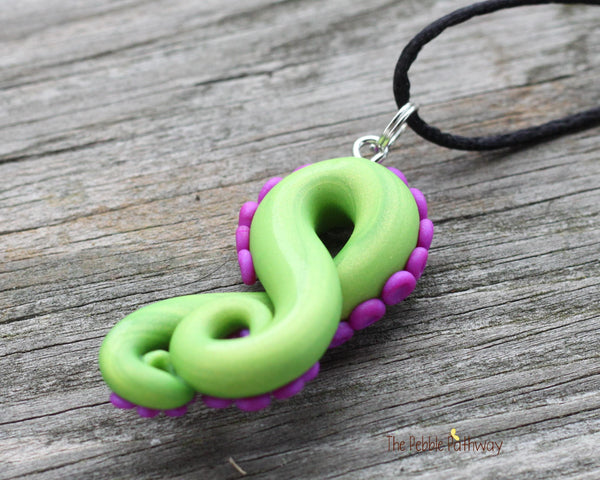 Green tentacle pendant and earrings with purple suckers, octopus themed jewelry