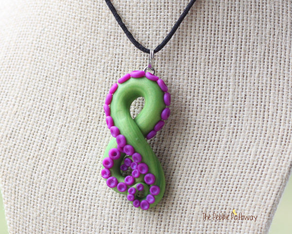 Green tentacle pendant and earrings with purple suckers, octopus themed jewelry