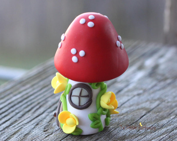 Tiny Red mushroom gnome home with yellow flowers and vines 2