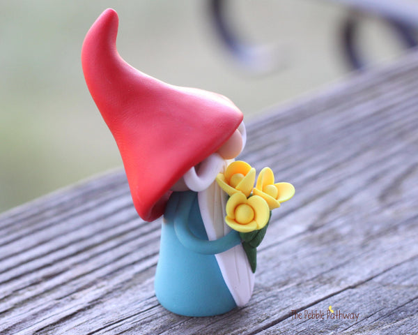 Gnome with bouquet of yellow flowers - miniature garden gnome figure