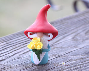 Gnome with bouquet of yellow flowers - miniature garden gnome figure