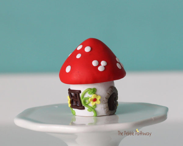 Tiny red mushroom with yellow flowers gnome home with removable top and gnomes inside