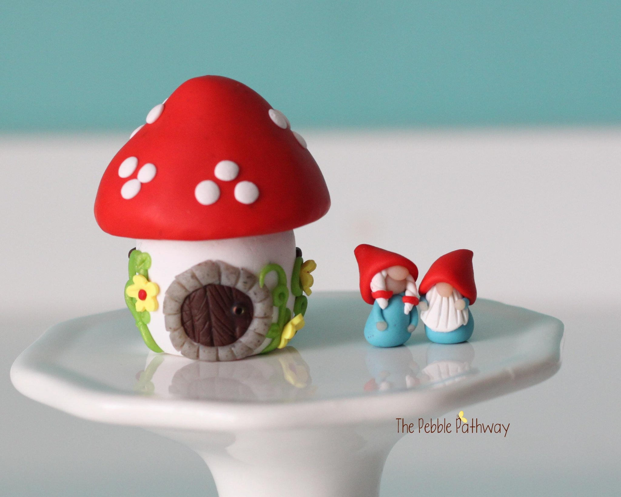 Tiny red mushroom with yellow flowers gnome home with removable top and gnomes inside