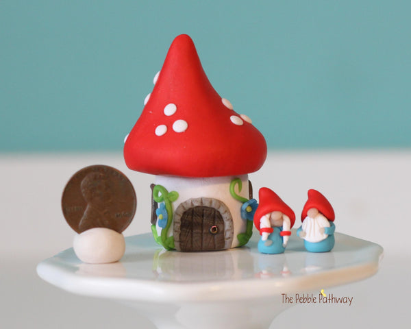 Tiny red mushroom with blue flowers gnome home with removable top and gnomes inside