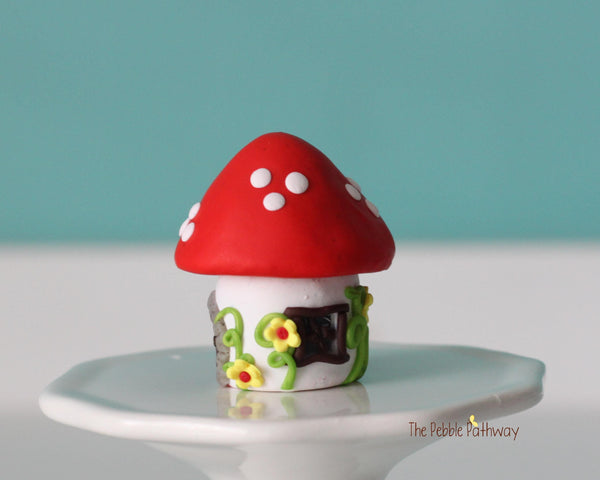 Tiny red mushroom with yellow flowers gnome home with removable top and gnomes inside