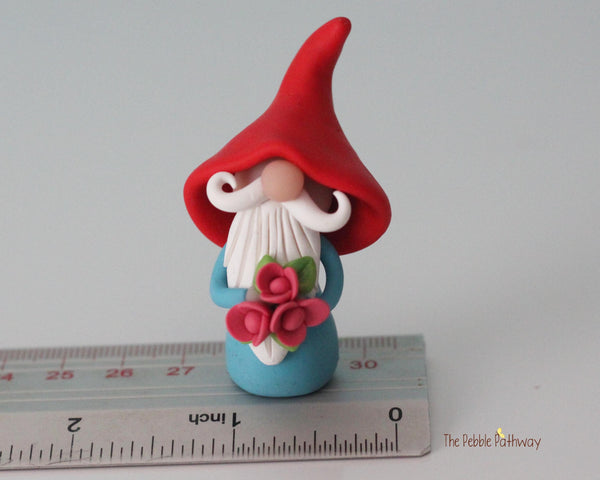 Gnome with bouquet of pink flowers - miniature garden gnome figure Dewitt