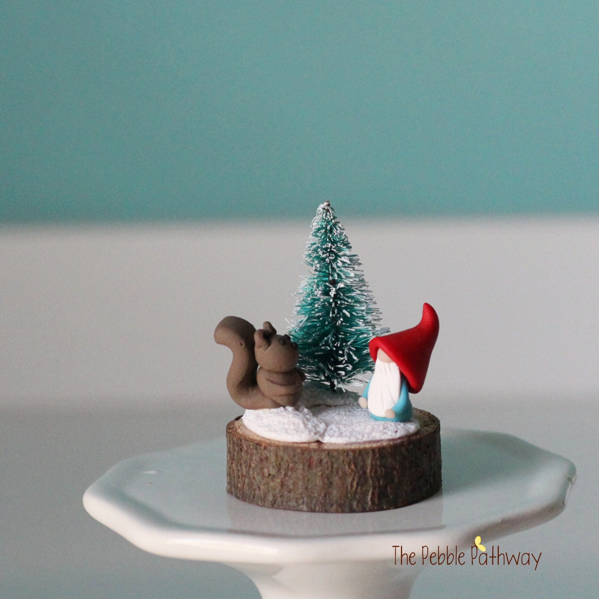 Micro mini gnome with tiny squirrel and Christmas tree on wood slice - ThePebblePathway